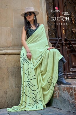 Rajtex fabrics by klutch presenting japan satin print sarees catalog by wholesale rate sarees catalogs
