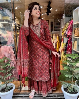 The three piece sharara set features an Embroidery Neck Design kurta  a flared sharara and intricately embroidered  Semi dupatta Amavi